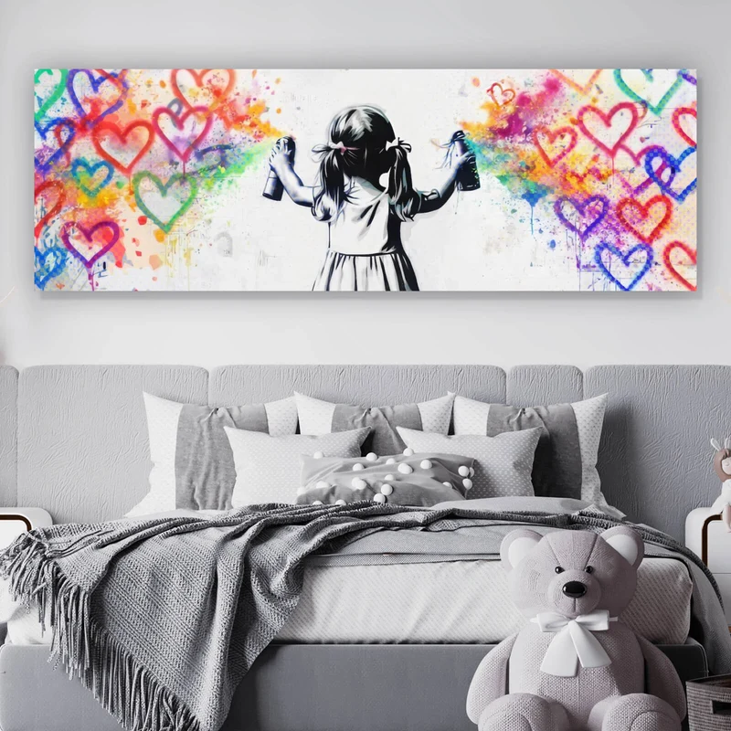 Leinwandbild Graffiti Mädchen sprüht Herzformen an die Wand Panorama