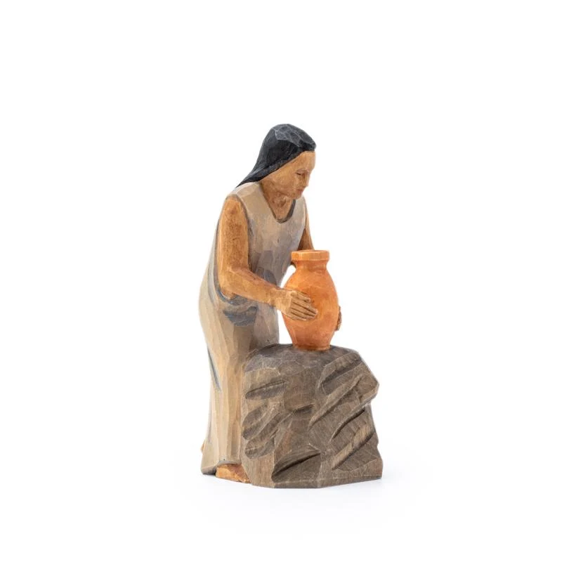 Frau mit Krug am Stein
