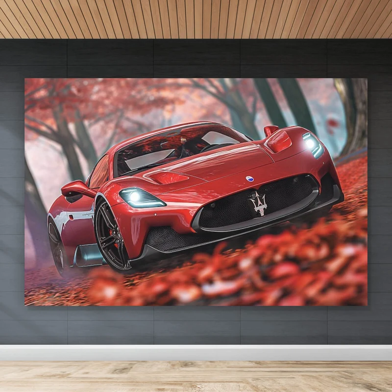 Leinwandbild Roter Sportwagen fährt durch herbstlichen Wald No.2 Querformat