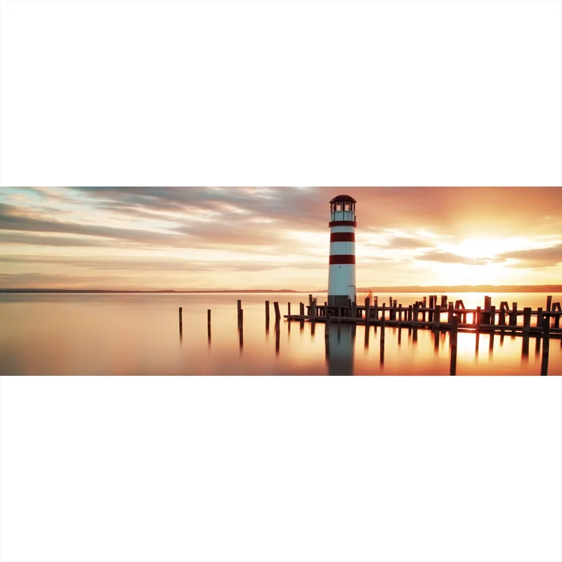 Spannrahmenbild Leuchtturm am Meer in der Abenddämmerung Panorama