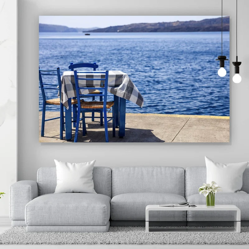 Leinwandbild Blauer Tisch am Meer Querformat